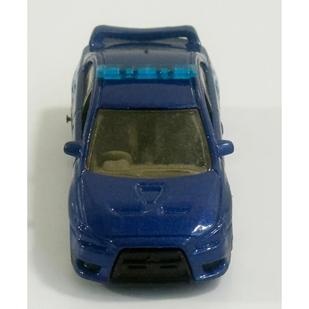 MATCHBOX 2010 BLUE MITSUBISHI EVOLUTION X POLICE 1:62 DIE-CAST TOY CAR MATTEL‎